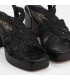 Sandalia de plataforma fabricada en piel negro con detalle trenzado